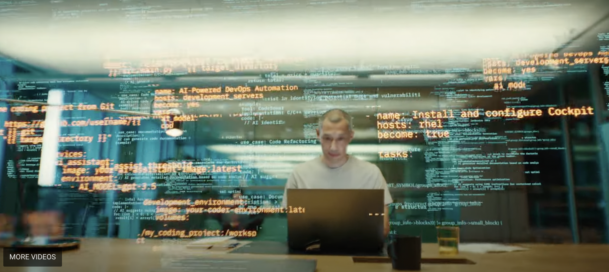 A flurry of data appears superimposed around a man working on a computer.