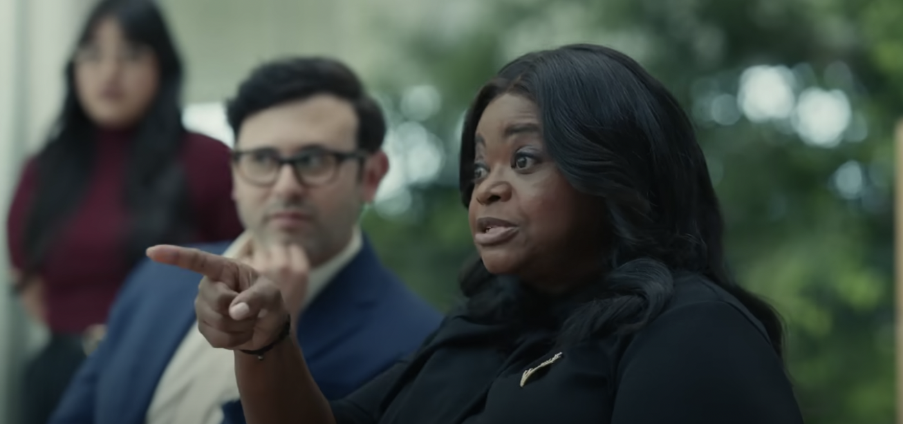 Octavia Spencer points a finger at a room full of Apple employees