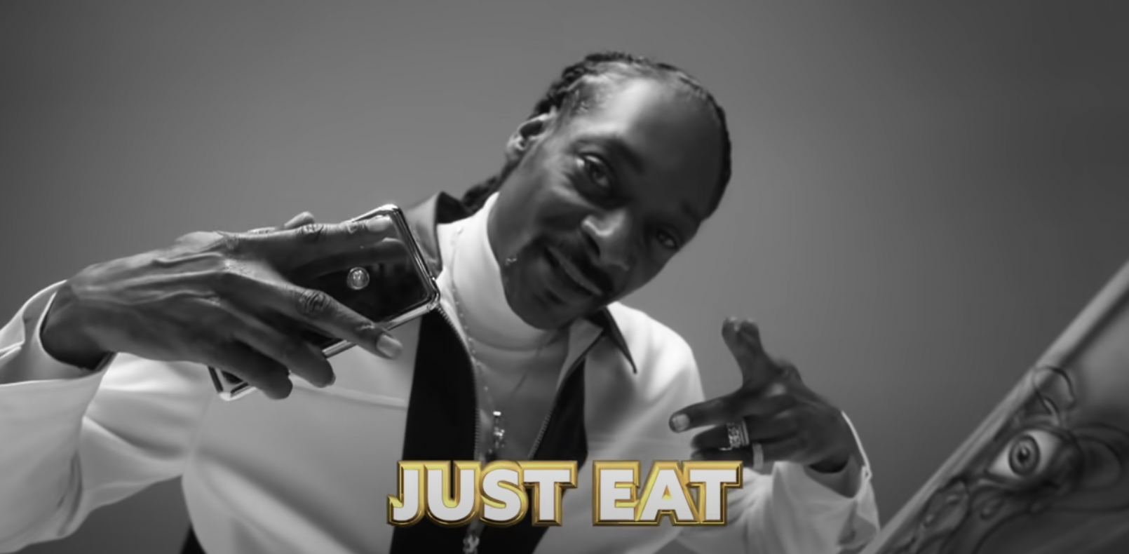Snoop Dogg appears in black and white with the words "Just Eat"