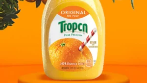 A Tropicana carton of orange juice in which the brand name is spelled without the letters "a" or "i"