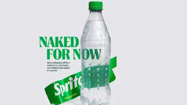 A Sprite bottle with the label torn off "Naked For Now"